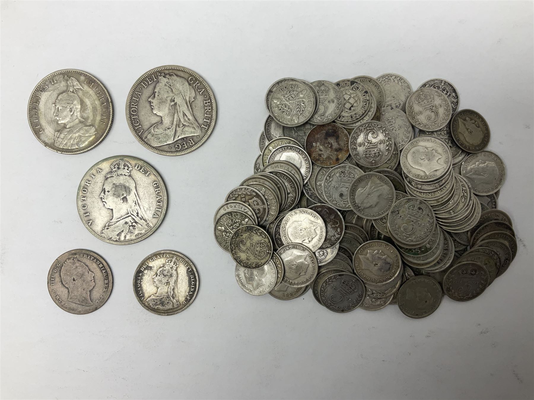German East Africa 1906 one rupie, Queen Victoria 1889 and 1900 halfcrowns, various pre-1947 Great British silver threepence pieces etc