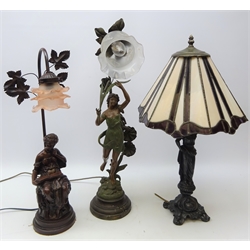  Tiffany style figural table lamp, leaded glass shade on cast metal base, H62cm, figural painted spelter table lamp with frill glass shade and another similar table lamp (3)  