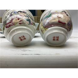 Two Chinese Yixing teapots, Chinese tea bowl hand painted with figures reading, another tea bowl with with underglaze floral panel and another tea bowl with saucer and lid, together with other teacups etc all boxed and with character marks