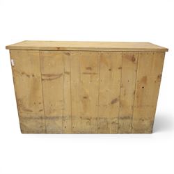Victorian pine dresser base, with rectangular plank top, above three short drawers over two cupboard doors