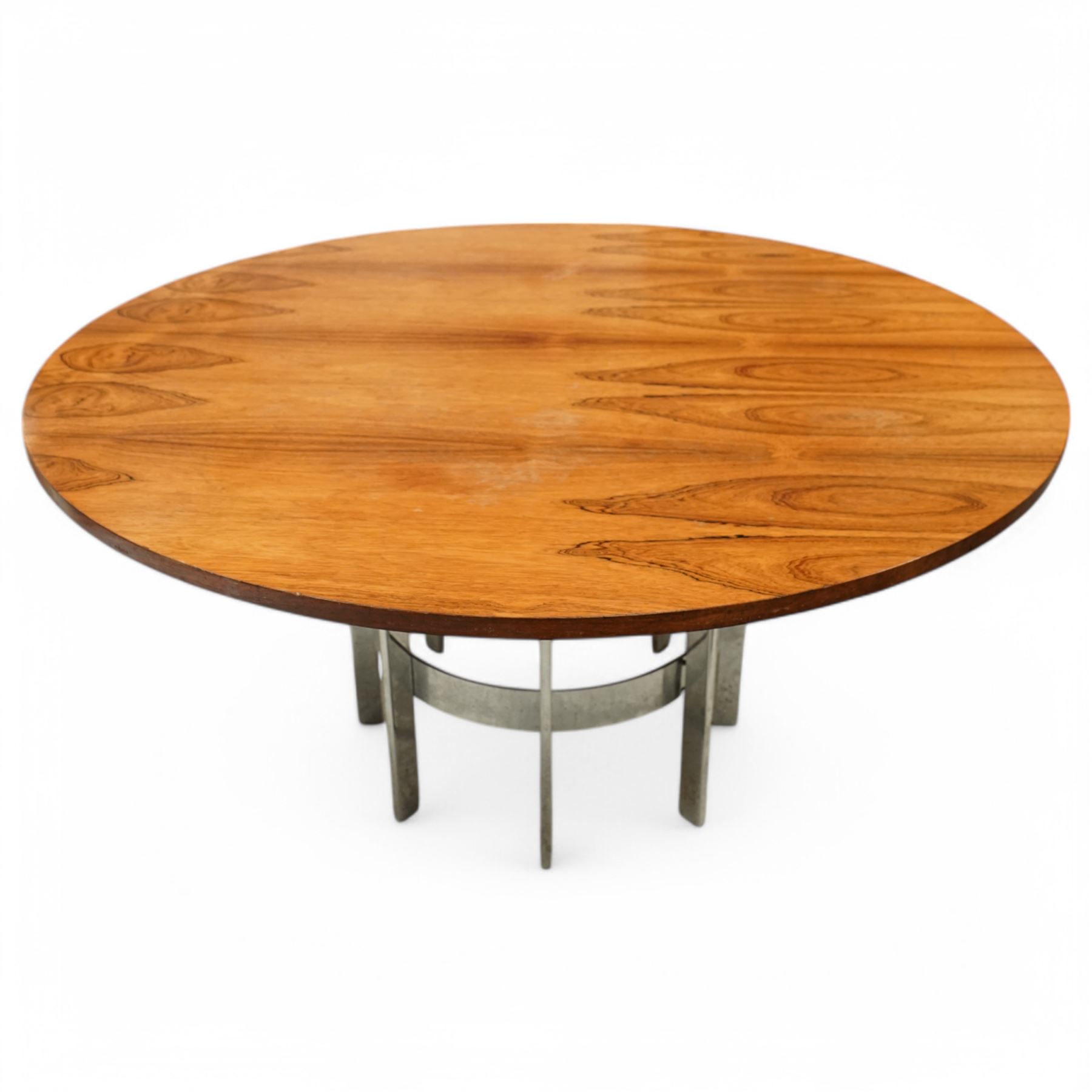Mid-century Merrow Associates rosewood and chrome dining table, the circular top with striking rosewood veneers, raised on a chromed steel base of eight supports joined by a central ring stretcher