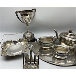 Group of silver plate, to include twin handled trophy cup upon black Bakelite plinth, Mappin & Webb five bar toast rack, pair of telescopic candlesticks, pedestal dish, twin handled tray, various tea wares, etc.