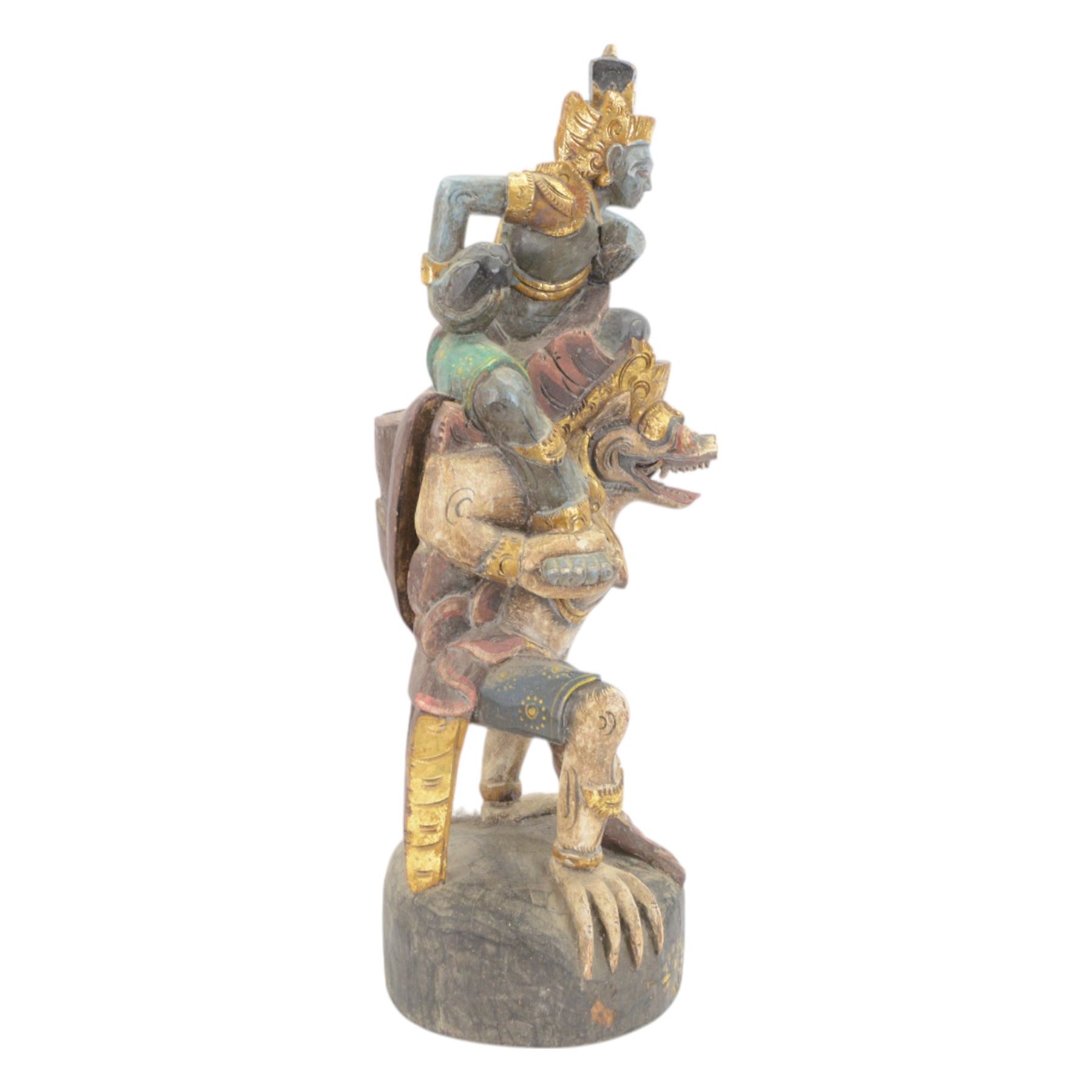 Hindu wooded sculpture depicting Vishnu riding on the shoulders of Garuda, H80cm