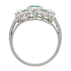 Platinum milgrain set emerald and diamond ring, the central octagonal cut emerald with calibre cut emeralds, old and single cut diamond surround, with World Gemological Institute Report