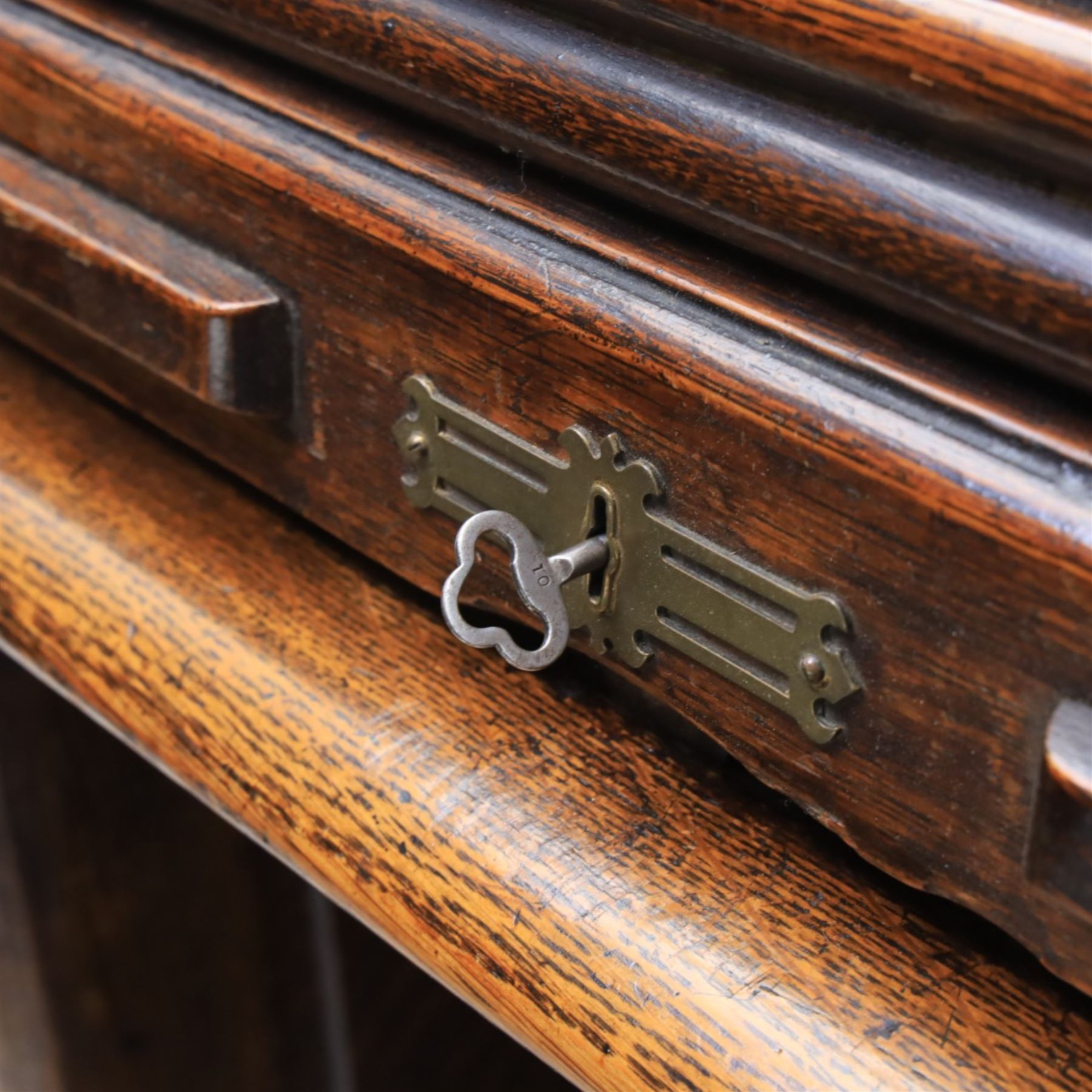 Globe Wernicke - Oak roll top desk, tambour roll top enclosing a fitted interior, raised on two pedestal bases with fitted drawers, raised on a plinth base 