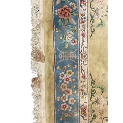 Large Chinese washed woollen carpet, pale sage green ground and decorated with flowers