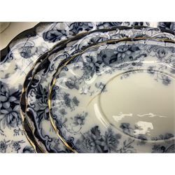 Blue and white Wedgwood & Co dinnerware, comprising plates, graduated platters, sauce tureens (lacking covers), and stands, and ladle, in one box 