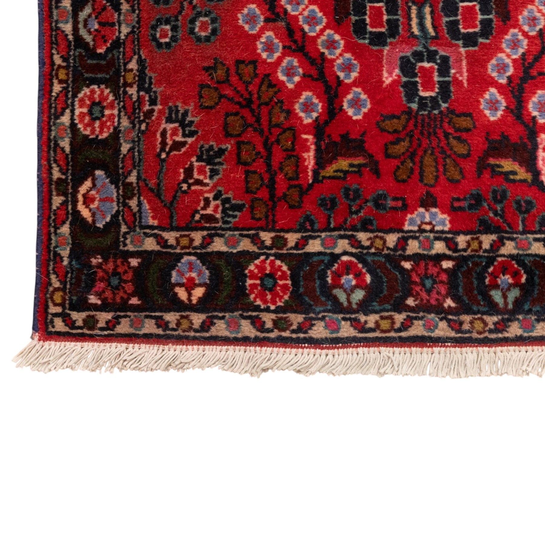 Two Persian rugs, the larger with a crimson field decorated with three linked indigo medallions amongst flowering tendrils, shaped floral spandrels and an indigo palmette border, (161cm x 129cm), the smaller with a crimson field centred by an ivory rosette amongst stylised flowering plants, within a dark floral border, (114cm x 79cm) (2)