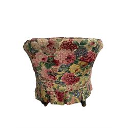 Victorian low tub shaped armchair, beech framed with compressed bun feet, loose floral fabric