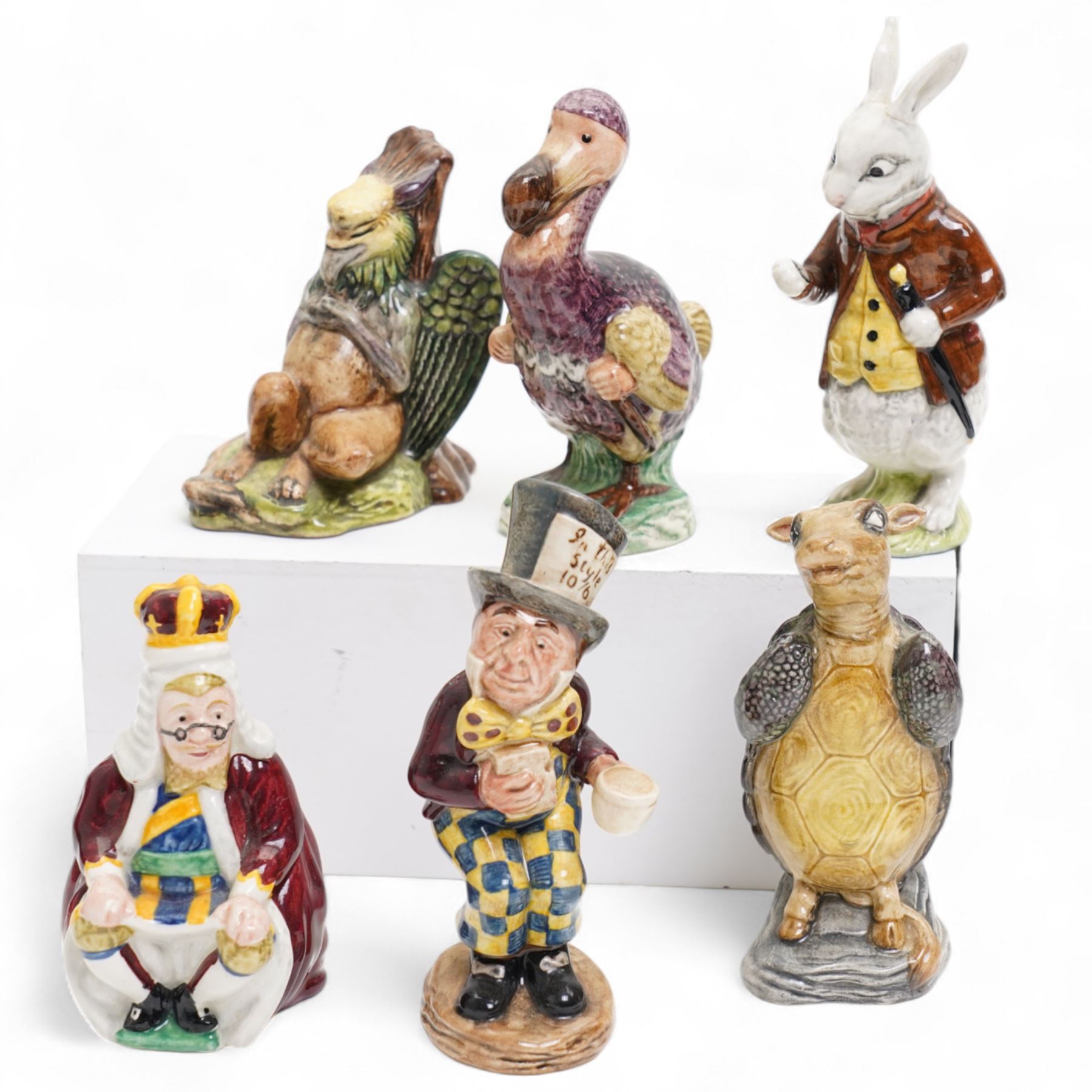 Nine Beswick Alice in Wonderland, including Alice, Queen of Hearts, King of Hearts, Gryphon, Dodo, Mock Turtle etc  