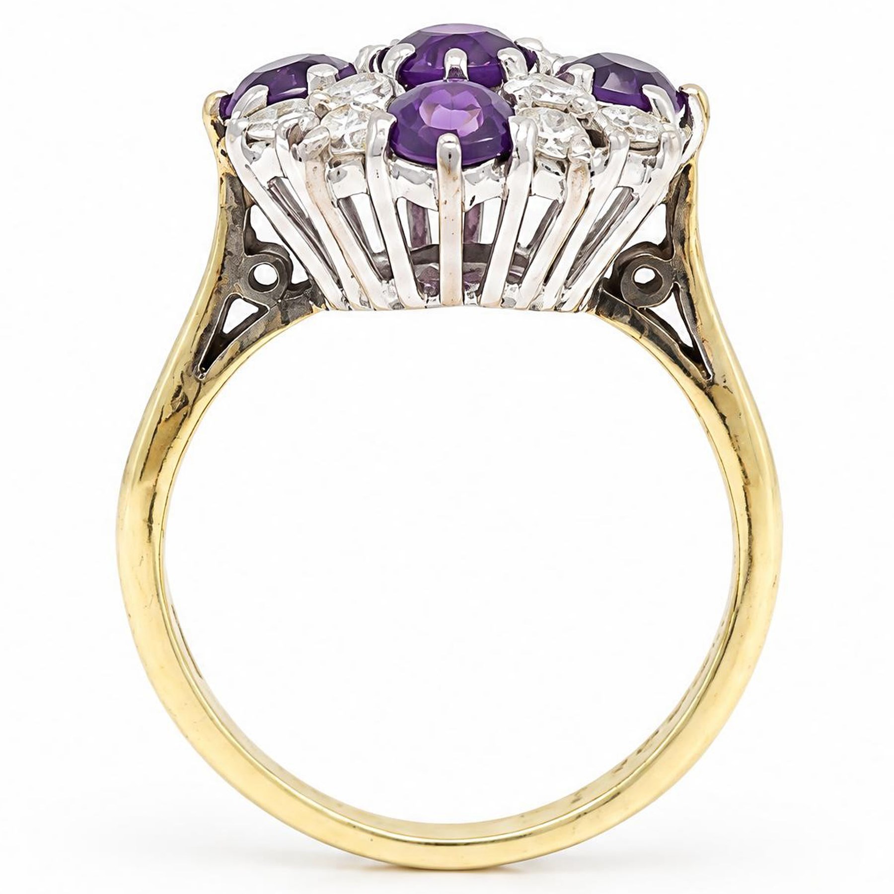 18ct gold amethyst and diamond cluster ring, five round cut amethysts, spaced by twelve round brilliant cut diamonds, London 1979, total diamonds 0.67 carat