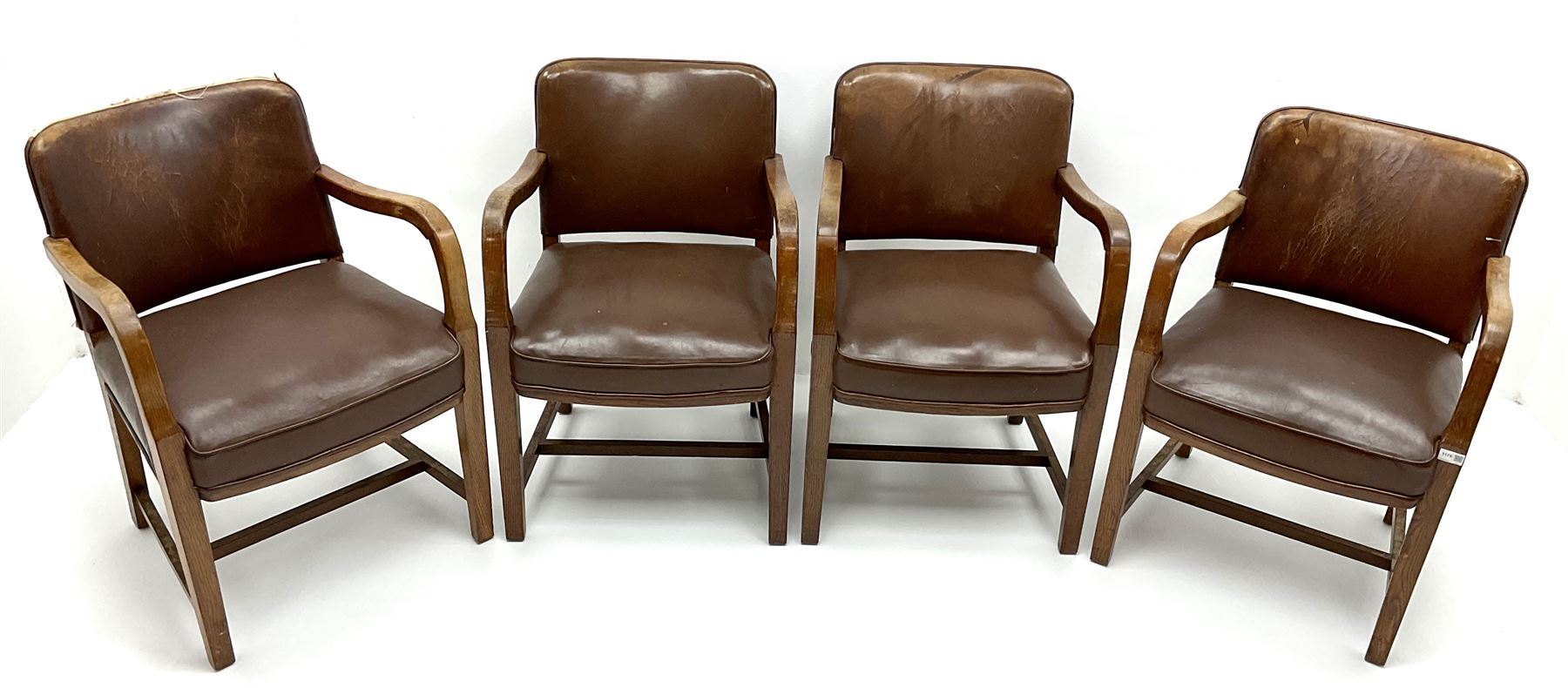 Set four mid century oak framed boardroom chairs, upholstered back and seat, shaped arms, square tapering supports joined by stretchers
