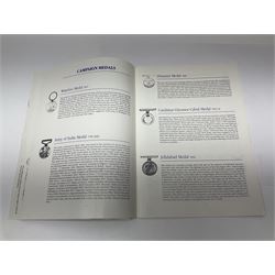 Limited edition large framed display board with sixty half-size copies of British Gallantry and Campaign Medals produced by Danbury Mint; all with ribbons and associated booklet