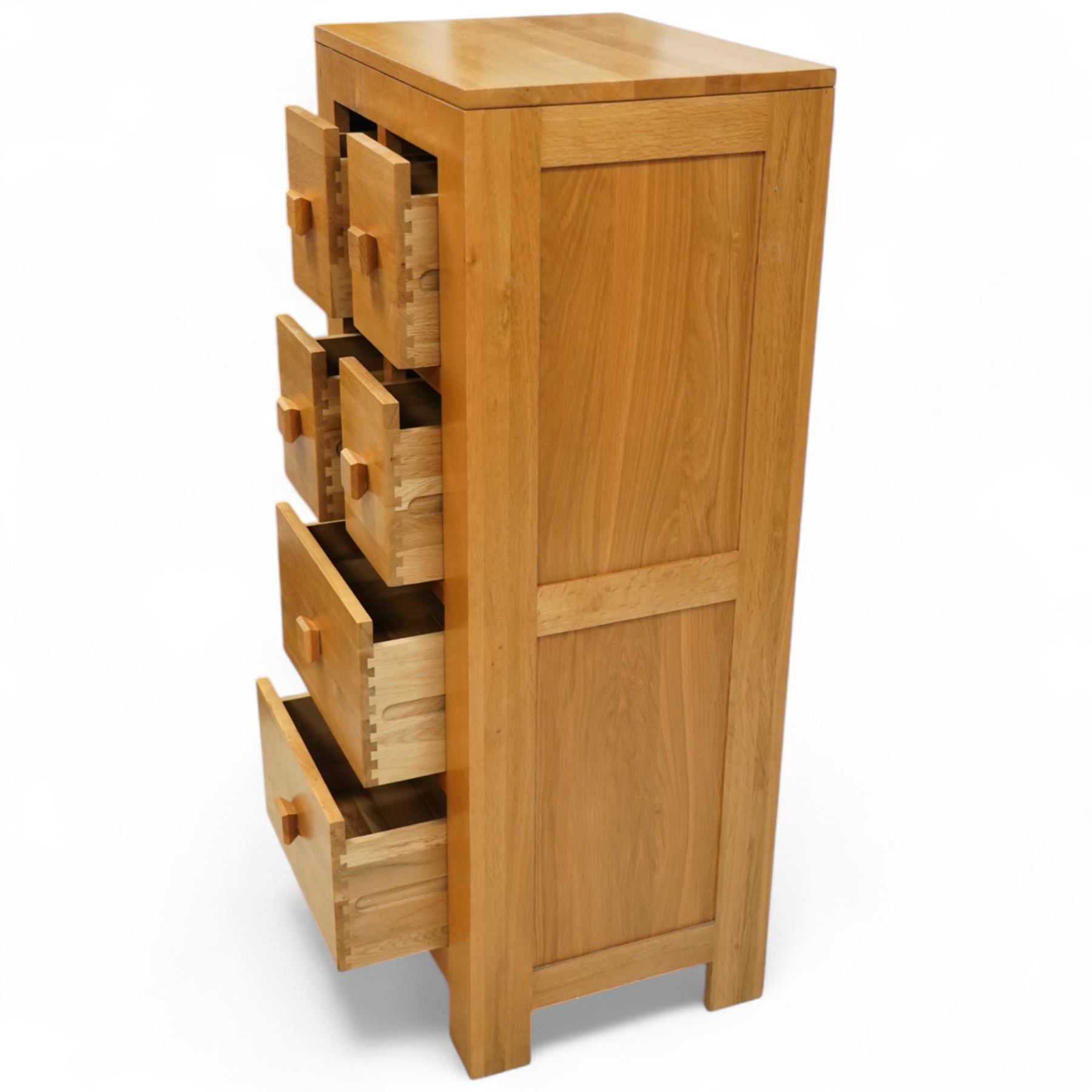 Modern light oak tallboy, the case fitted with six drawers including two pairs of short upper drawers and three full-width below, square pull handles throughout, supported on straight square legs with inset side panels