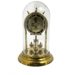 Schatz - mid-20th century German 400 day torsion clock, with a gilt dial and black chapter, Arabic numerals and pierced hands, three ball rotary pendulum and glass dome, original box, packaging and instruction booklet. Torsion suspension spring intact.
