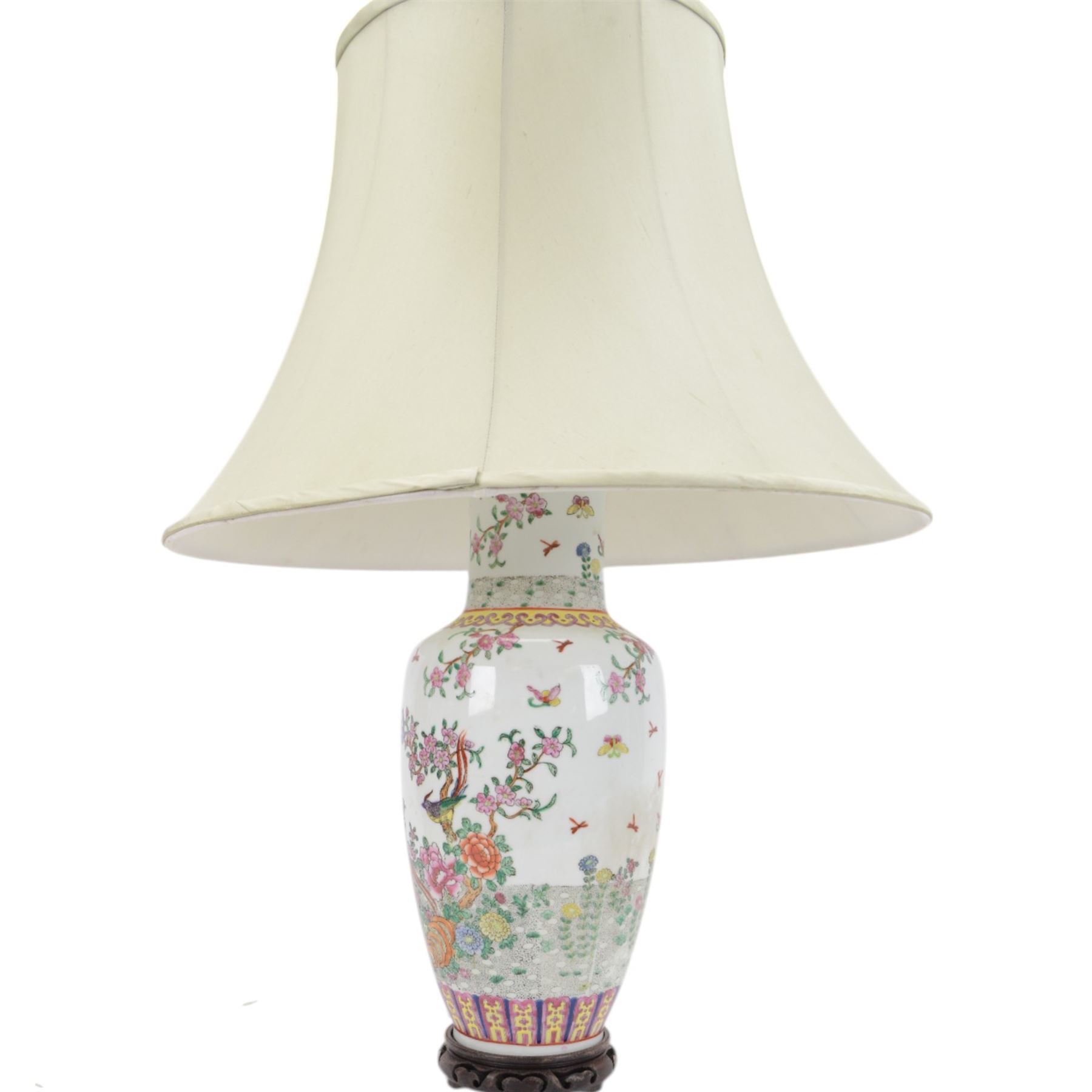 Chinese famille rose table lamp, of baluster form, decorated with birds in blossoming branches, upon a circular wooden base with shade, H78cm