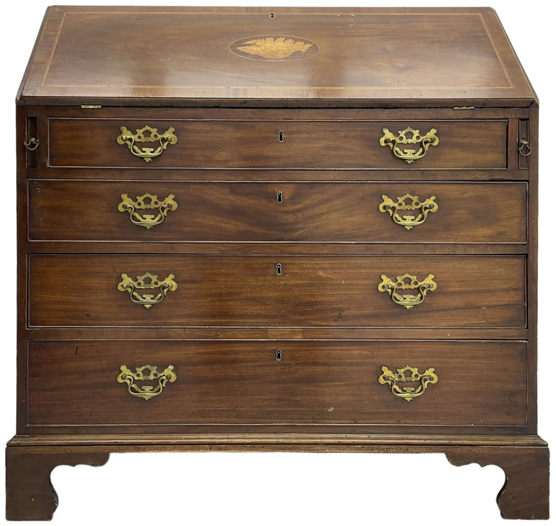 George III mahogany bureau, the conch inlaid fall front enclosing pigeon holes, shelves and central cupboard with inlaid flower motif, four graduating cock-beaded drawers below each with brass handles, lower moulded edge over shaped bracket feet