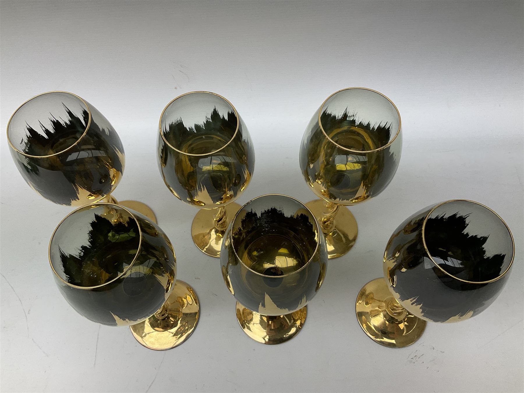 Set of six Art Deco style green glass sundae dishes, H9cm along with set of six Bohemian style glasses with twisted gilt stems