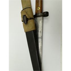 WWII Lee Metford rifle bayonet with original scabbard marked 586, with canvas frog, L44cm overall 
Notes; due to the condition of the bayonet it is possible this was issued to the home guard