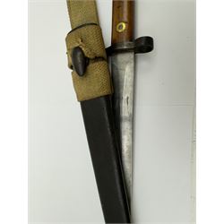 WWII Lee Metford rifle bayonet with original scabbard marked 586, with canvas frog, L44cm overall 
Notes; due to the condition of the bayonet it is possible this was issued to the home guard