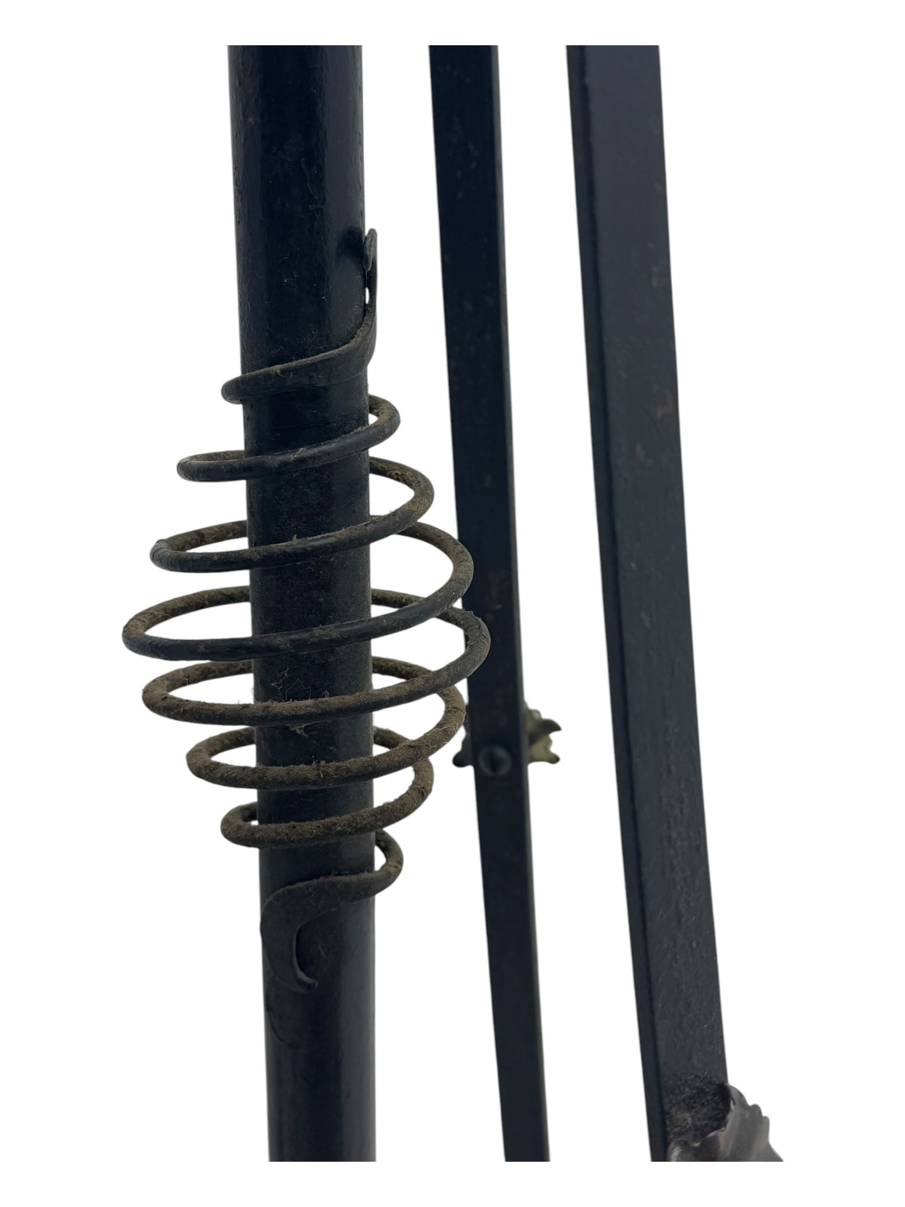 Late 19th century wrought iron and brass pulpit lamp, featuring an adjustable stem with a spiral twist detail, brass foliate mounts, and a tripod base with scrolled feet and decorative floral accents