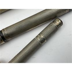 Three parker fountain pens, one example with 14ct gold plated cap and personal engraving, in Parker 51 box, together with a silver Sampson Mordan Everpoint propelling pencil with personal engraving and a silver cased fountain pen with 14ct gold nib and a souvenir bronze Dollfus-Mieg medallion, awarded to John G Sedorski, in fitted case 