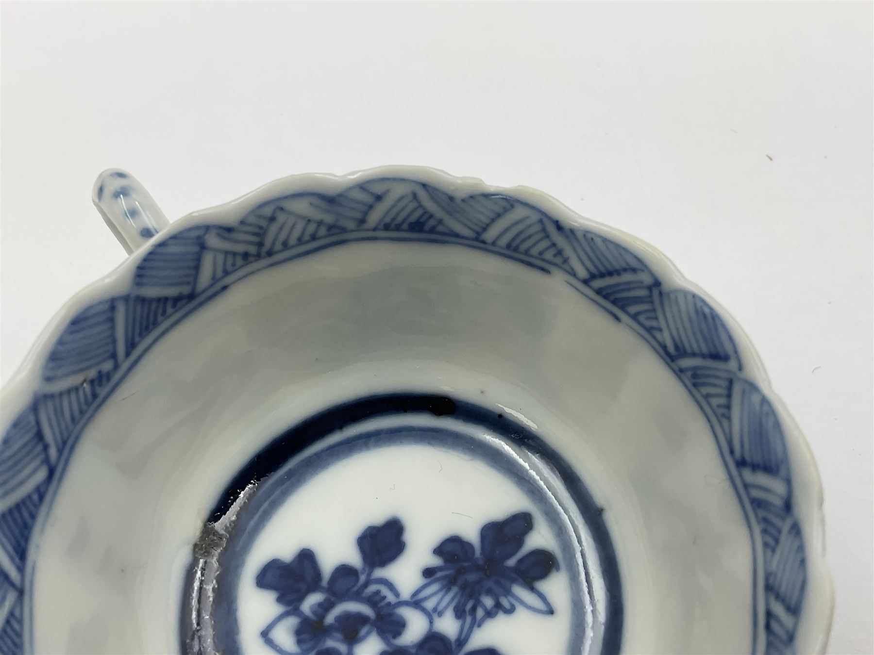 18th century Chinese blue and white Kangxi teacup and saucer, decorated with dancing figures, four character Kangxi mark beneath, saucer D10cm