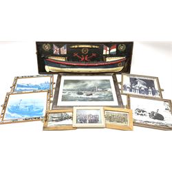 RNLI collection box in the form of a boat makers half block model, painted in the colours of a lifeboat with flag and ship motifs, H25cm, L73cm together with framed photos, postcards and prints of lifeboats and crew, including Scarborough lifeboat station