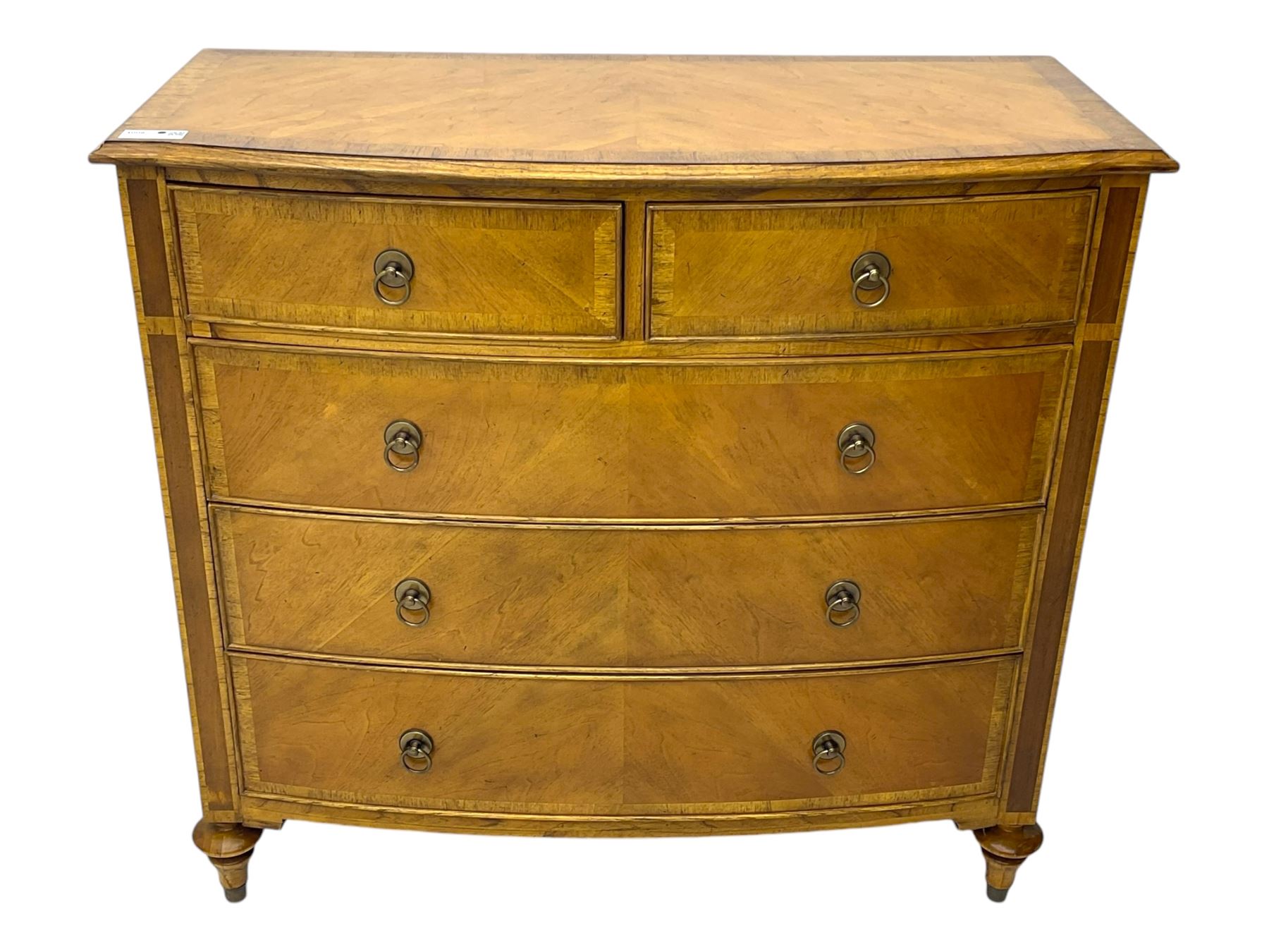 Frank Hudson - mid-20th century Mindi ash and burr walnut 'Spire' bow-fronted chest, featuring a crossbanded top over two short and three long cockbeaded drawers, raised on turned supports  