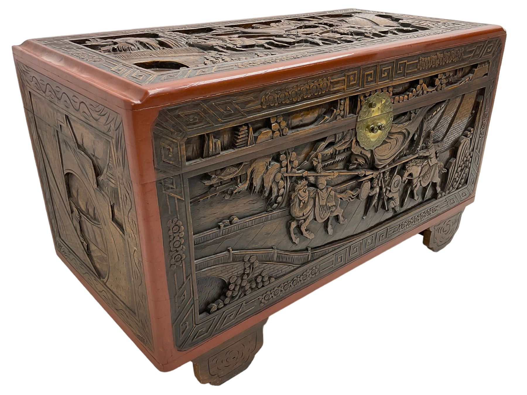 Mid-20th century Singapore camphor wood blanket chest, heavily carved depicting battle scenes and cityscapes 