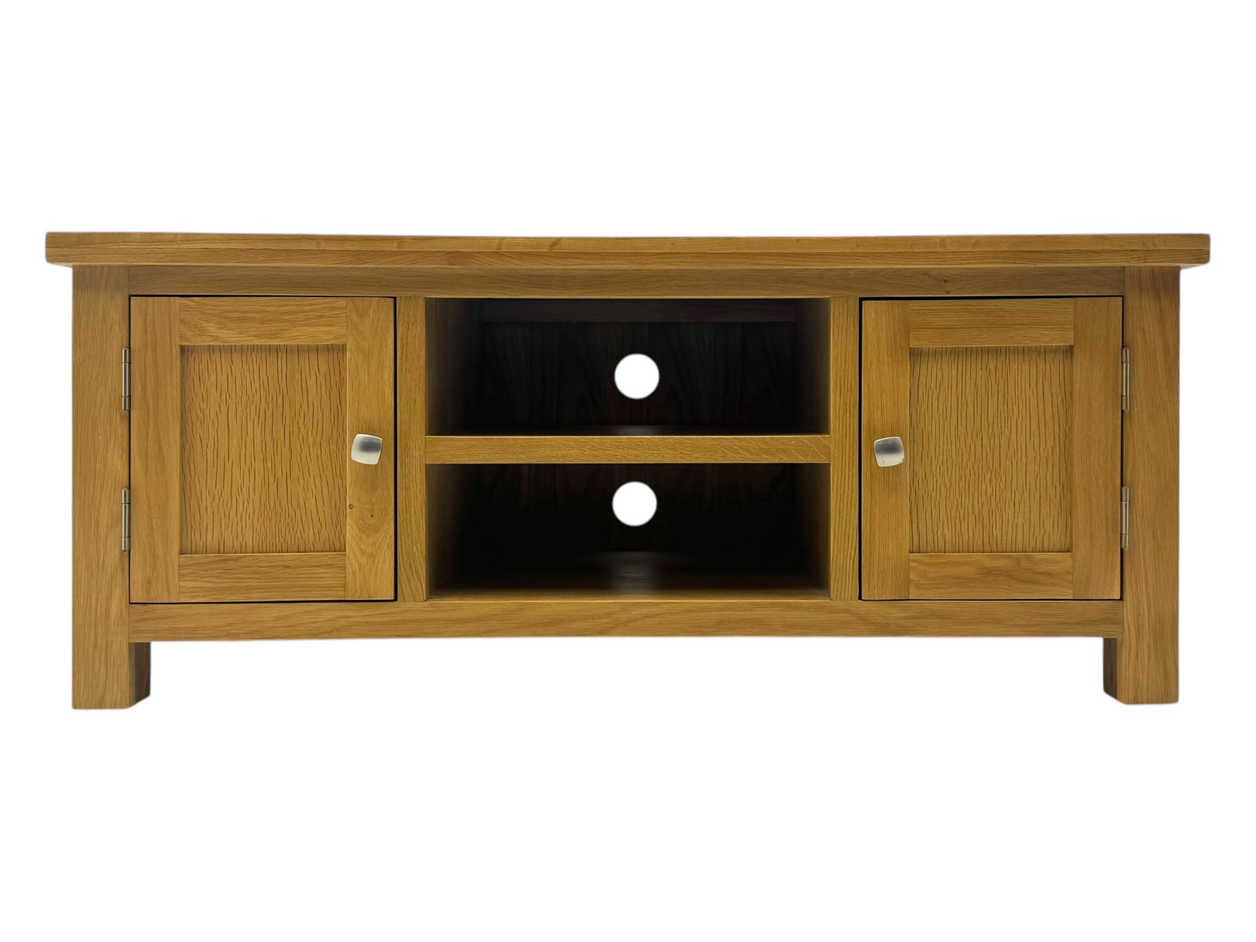 Contemporary oak television stand, rectangular top over two central open compartments, flanked by panelled cupboard doors enclosing additional shelves, raised on stile supports