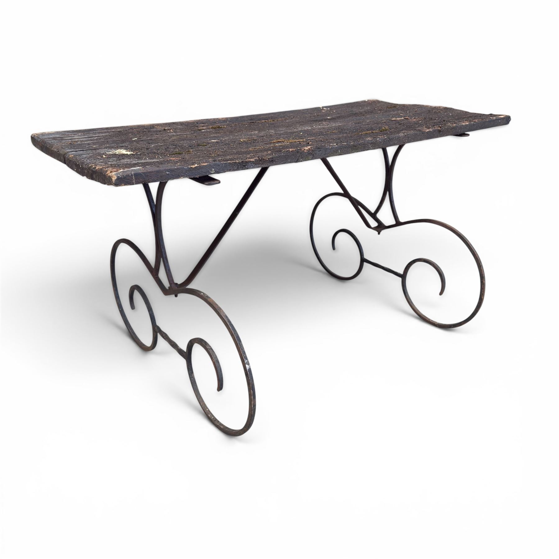 Cast iron garden table, with rectangular weathered slatted wooden top, raised on iron strapwork supports of scrolling form, in black painted antique finish 
