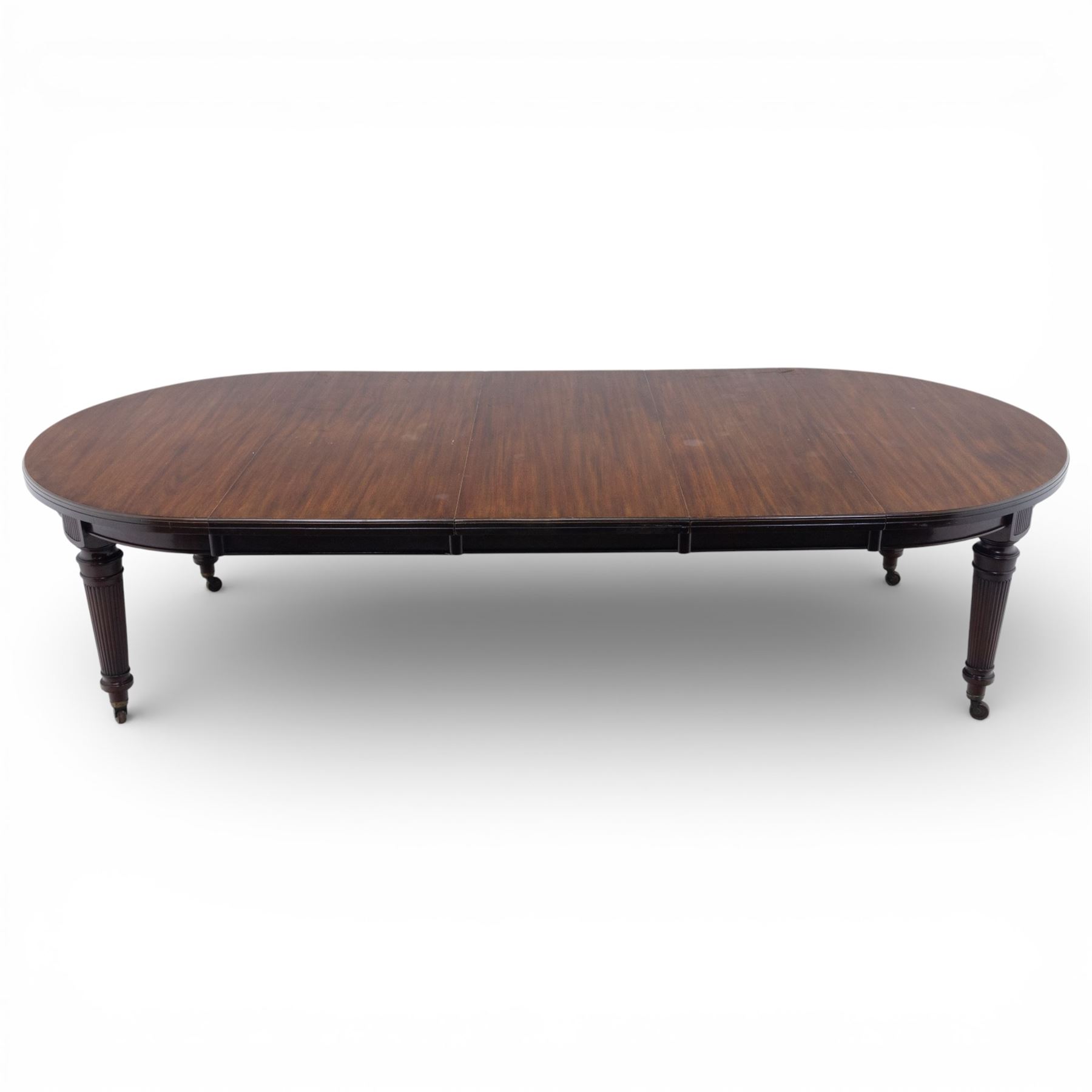 Spillman & Co. London - large Victorian mahogany extending dining table with three additional leaves, upon turned and reeded supports with ceramic castors, bearing ivorine label beneath detailed 'Spillman & Co. St. Martins Lane, London', extends to 302cm