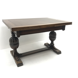 20th century oak drawer leaf dining table, two gadroon cup and cover baluster supports on sledge feet connected by stretcher, 91cm x 122cm - 214cm (extended), H79cm