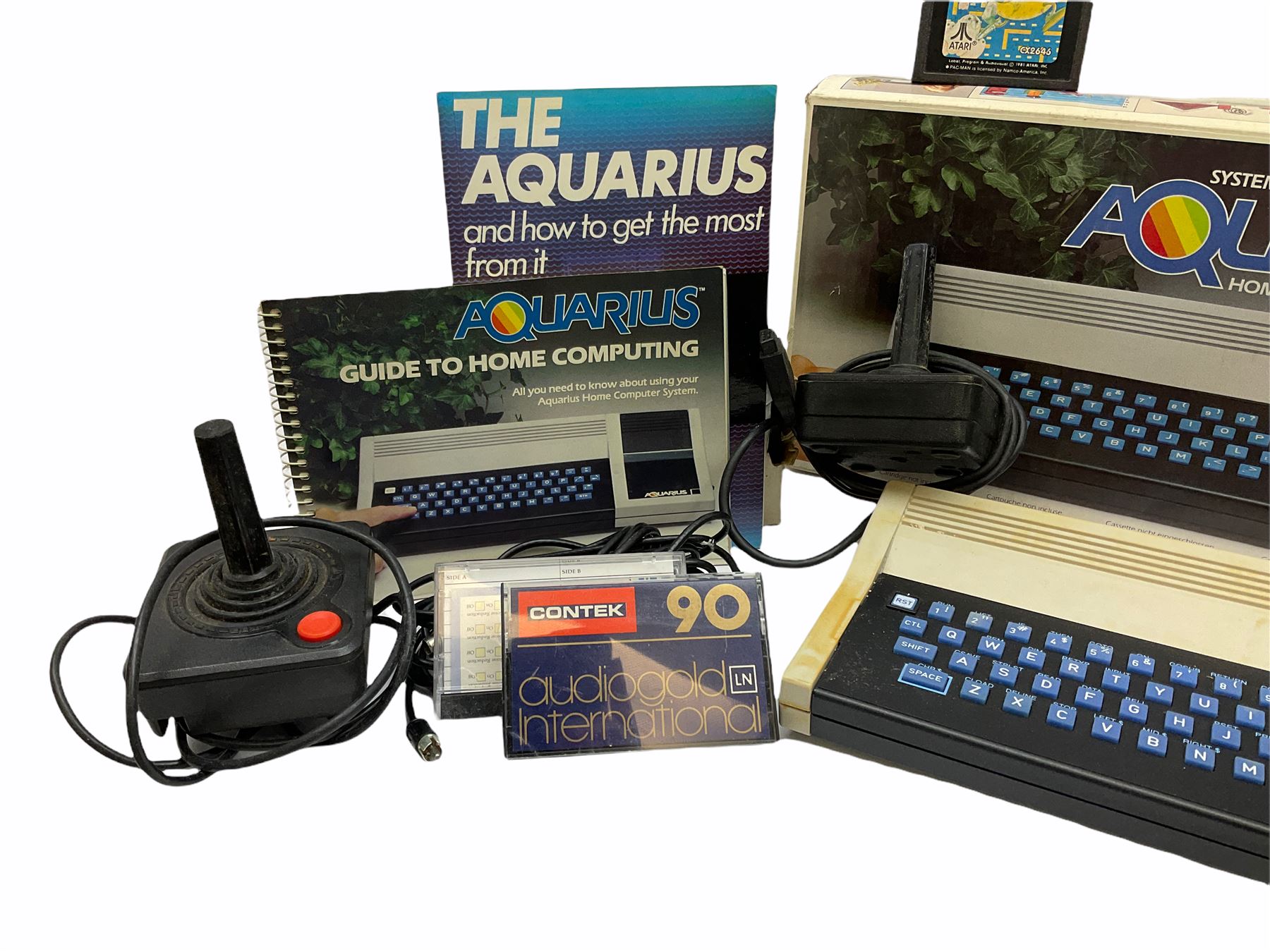 Mattel Aquarius Home Computer System c1982/3, with Mini-Expander, Data Recorder and 16K Memory, all boxed, and two instruction booklets; Grandstand Invader From Space and Palitoy Merlin electronic games; unopened blister packed Casio Portable TV-980; and quantity of game accessories