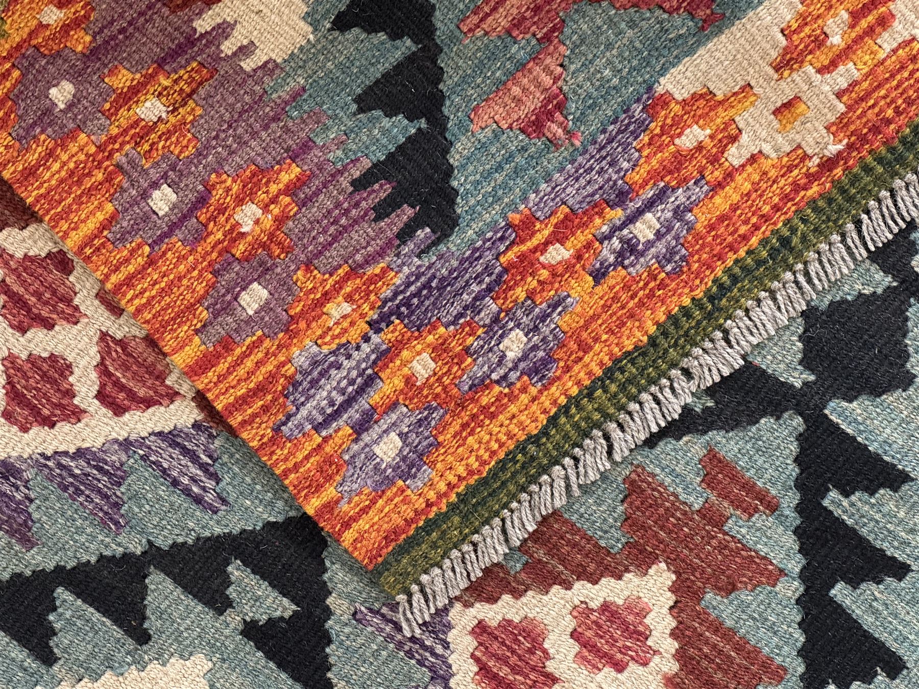 Afghan Maimana Kilim flatweave runner, handwoven with a deep teal ground showcasing a vibrant multicoloured diamond-lattice design in the traditional Maimana style, enclosed by stylised borders and finished with fringed edges 