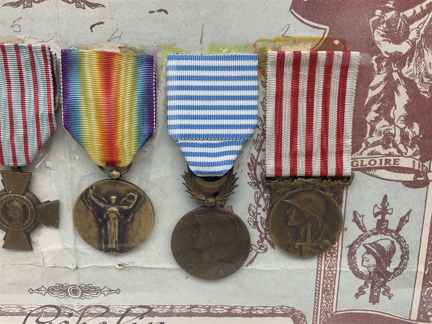 Six WW1 French medals comprising Valor Discipline 1870 3rd Republic Military Medal, Croix De Guerre with star, Croix Du Combattant, Medaille Inter-Alliee De La Victorie, Orient Medal and Medaille Commemorative De La Grande Guerre 1914-18; all with ribbons; mounted, framed and glazed with certificate named to Mr. Gebelin Herve Brigadier au 4th Chassrs. D'Afrique