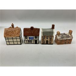 Twenty studio pottery figures of houses and cottages, comprising seventeen Mudlen End Studio Felsham Suffolk examples and two John Putman's Heritage Houses examples