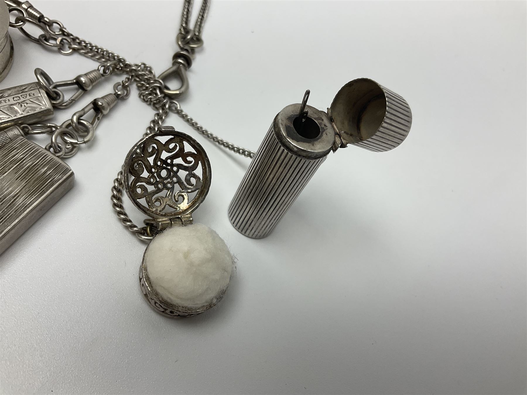 Victorian style silver chatelaine necklace, suspending eight silver sewing and similar accessories, including tape measure, needle case, pencil holder, powder compact and pill box