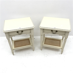 Pair Laura Ashley cream finish bedside lamp tables, single drawer, turned supports joined by canework undertier, W51cm, H62cm, D39cm