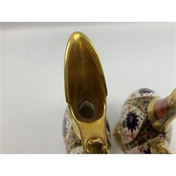 Pair of mid 20th century Royal Crown Derby Imari 1128 pattern Kedleston ewers, each with gilt scroll handle and neck, upon a gilt quatrefoil foot, each with printed marks beneath, H25.5cm