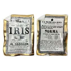 Two Fornasetti rectangular operatic posters ashtrays 'Norma' and 'Iris' decorated with black and white text with a gilt border edge, with printed mark beneath, H16cm