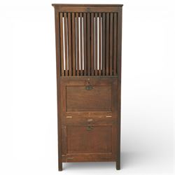 19th century Anglo Indian teak clothes airer cabinet, the rectangular top above a slatted upper compartment enclosed by twin doors, over two fall front compartments with metal drop handles, plain panelled sides and raised on square section supports