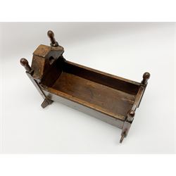 Late 18th century stained pine miniature or dolls rocking cot, H24.5cm L31cm
