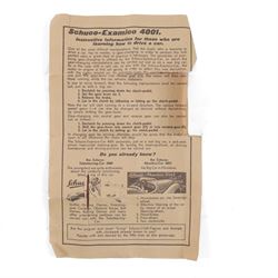 Schuco Examico 4001 tinplate clockwork car, in red with burgundy interior, with key and instructions, boxed