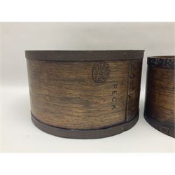 Two 19th century wood and metal bound grain measures, stamped Peck and Gallon, Peck D29cm, Gallon D22cm 