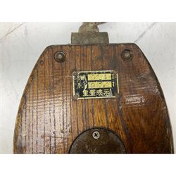 Three ship pulleys comprising wooden block double with stiff swivel hook, wooden block double with swivel eye and wooden block with stiff swivel hook, largest example L52cm