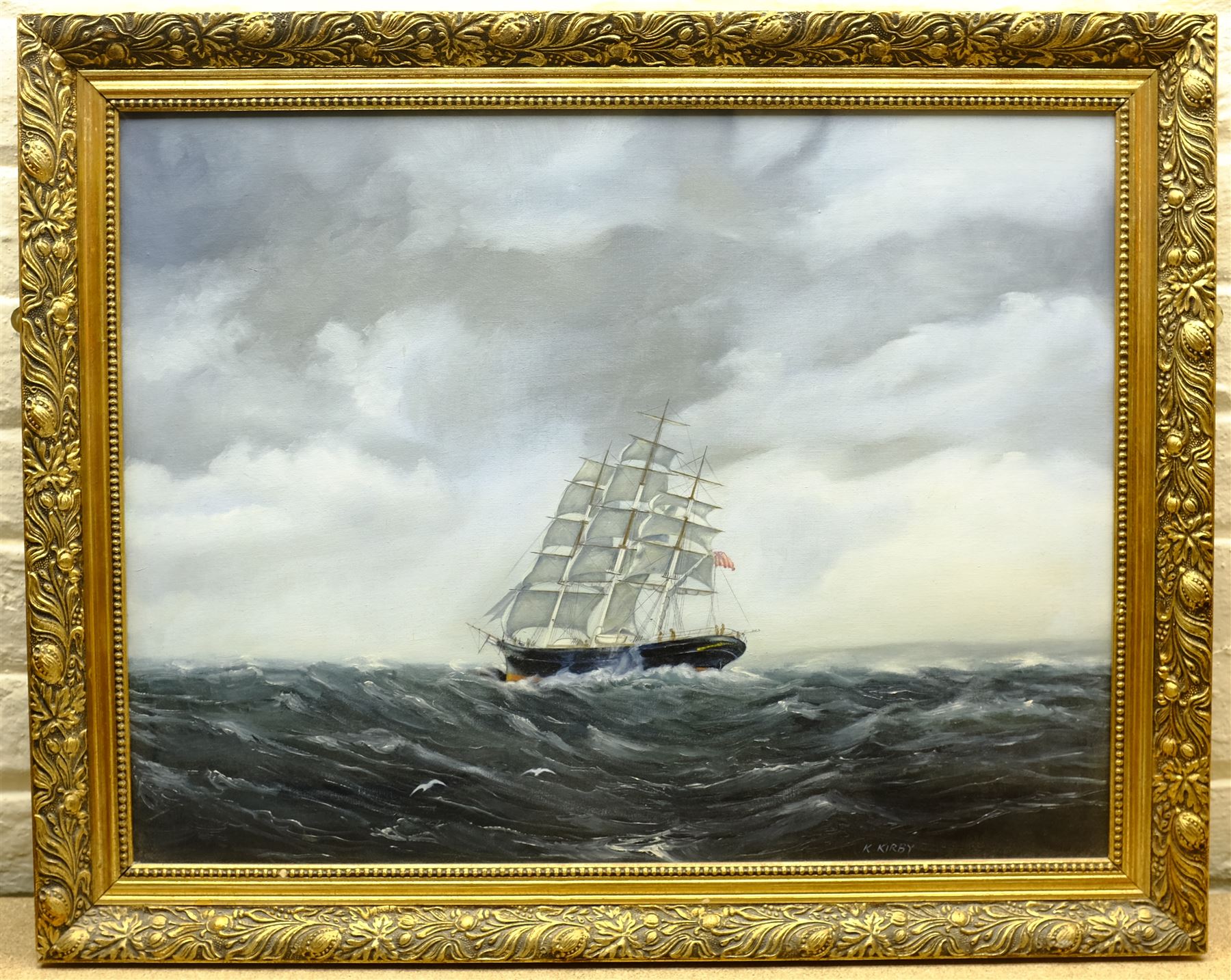 K Kirby (20th century): 'Mighty Sea', oil on board signed, titled verso 49cm x 65cm; C Alexis (20th century): Sailing Barge Becalmed, oil on canvas signed 50cm x 60cm (2)