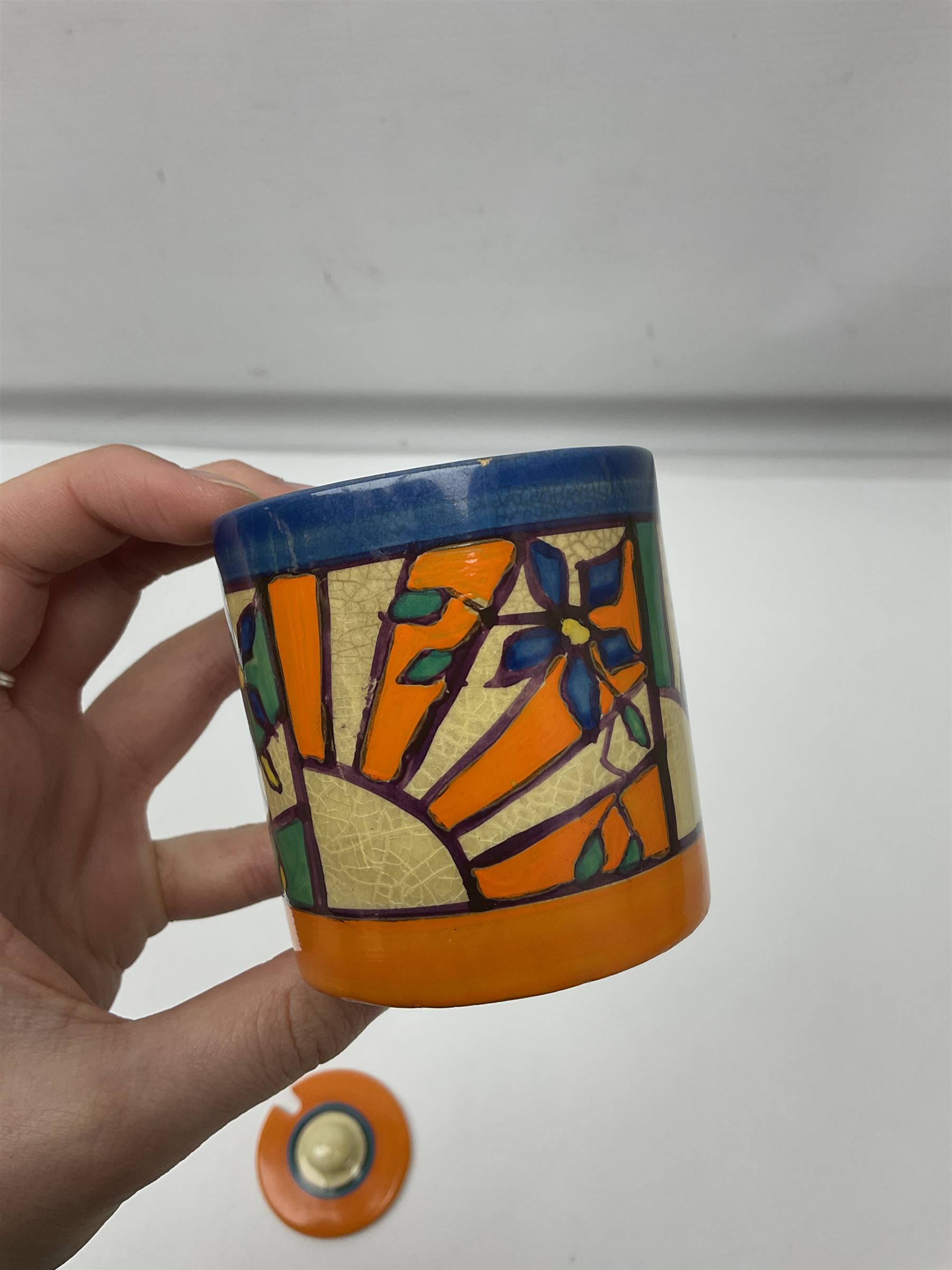 Clarice Cliff Fantasque for Wilkinson Pottery preserve pot, circa 1928, of drum form decorated in Sunray Leaves pattern, H8cm