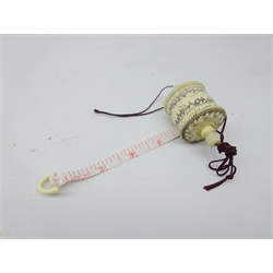  20th century Japanese bone tape measure with incised decoration, L7cm   